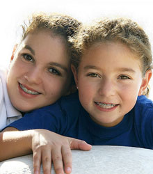 stock photo of two sisters with braces